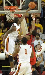 Senior Marcus Simmons shown here making one of his two key blocks in USC's win vs. No. 10 Arizona on Feb. 24 (Photo courtesy of Kirby Lee).
