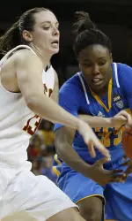 Southern California's Kari LaPlante (13) and UCLA's Jasmine Dixon (33) battle for the ball during the second half.