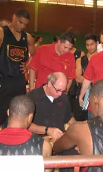 Head coach Kevin O'Neill addresses the team before the game begins.