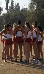 The Trojans had a team huddle before the race and a total team-effort during the race to place second today at the Highlander Invitational.