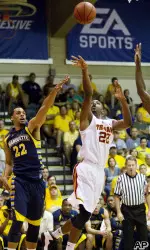 Byron Wesley puts up a shot under pressure.