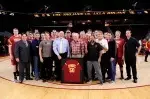 Ceremony with current and former USC players and coaches honoring retiring UCLA coach Al Scates (middle, in tie) in his final regular season visit to USC in his 50-year career.  He was presented with an honorary USC jersey.