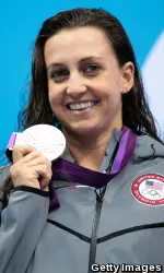 Rebecca Soni displays her silver medal after her second-place swim in the 100m breast at the 2012 Olympics on Monday.