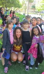 Swimmer Nikki Chang gives a campus tour to middle school girls.