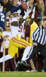 Marquise Lee leaps for the ball.