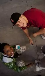 The Otis Booth Foundation gift provides long-term funding for the Community Outreach program, which supports Trojan student-athletes' volunteer efforts to engage and inspire the neighborhoods surrounding USC.