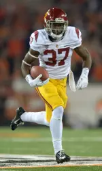 Javorius Allen carries the ball.