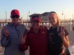 Kirby Burnham (left) and Sara Hughes (right) with USC head coach Anna Collier.