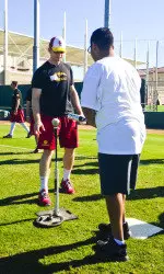 Kevin Swick sets up a base hit for his buddy.