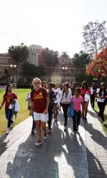 Senior Ceilidh Meagher leads girls on a campus tour.