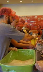 Members of the Athletic Department pack meals for the Philippines.