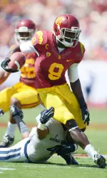 Receiver Marqise Lee (9) is tackled by Aggies cornerback Tay Glover-Wright (4). Mandatory Credit: Kirby Lee-USA TODAY Sports