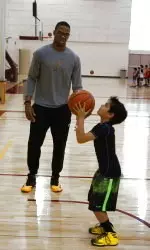 Darion Clark offers instruction to a local Cub Scout.