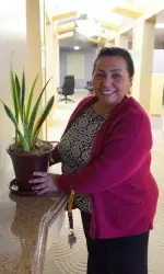 Guadalupe Lopez of 32nd Street School selects an item to brighten her office.