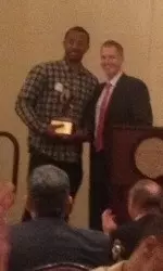 Byron Wesley receives the 2013-14 MVP Award from head coach Andy Enfield.