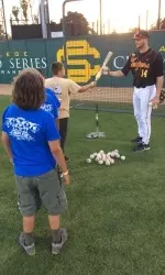 Sophomore Vahn Bozoian teaches kids to hang tough at the plate.