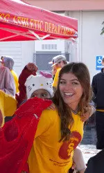 Dion entertains her mentee at the Community Bowl.