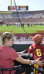 Trojan fans enjoying their view from the Field Suites.