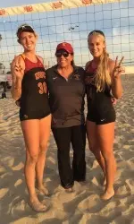 Kelly Claes and Sara Hughes with head coach Anna Collier.