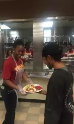 Women's basketball players prepared and distributed hot dogs, chili and chips from the Los Angeles Mission kitchen.