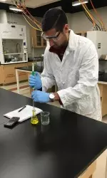 Student-athlete Samer Dhillon at work in the lab.