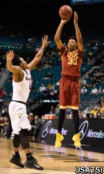 Elijah Stewart shoots the basketball against Arizona State Sun Devils guard Tra Holder.
