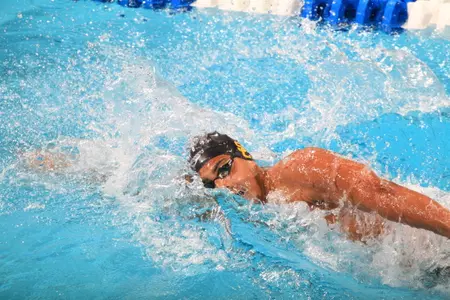 Dylan Carter swims the second leg of the 800y free relay