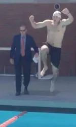 USC Athletic Director Pat Haden looks on as Trojan quarterback Cody Kessler kicks off the 35th annual Swim With Mike with a splash.
