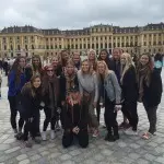 The USC women's sand volleyball team in front of Vienna's Schronbrunn Palace.