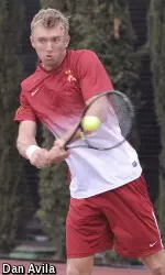 Freshman Jake DeVine won in doubles and singles in a key road win for the Trojans.