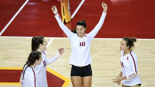 Women's volleyball setter Raquel Lázaro celebrates a point against Arizona
