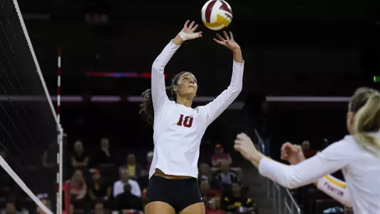 USC women's volleyball freshman setter Raquel Lázaro sets the ball at the 10-foot line.
