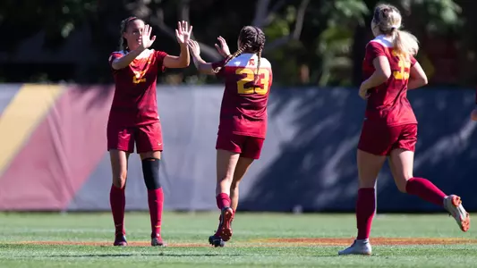 Ally Prisock gets high-fives from teammates after scoring the winner vs. Arizona