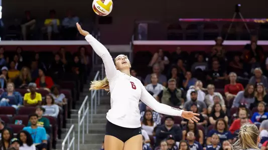 Jr. opposite hitter Emily Baptista attacks the ball.