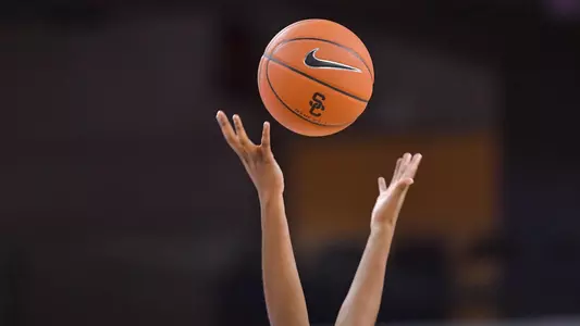 The ball goes up for grabs on the opening jump at Galen Center