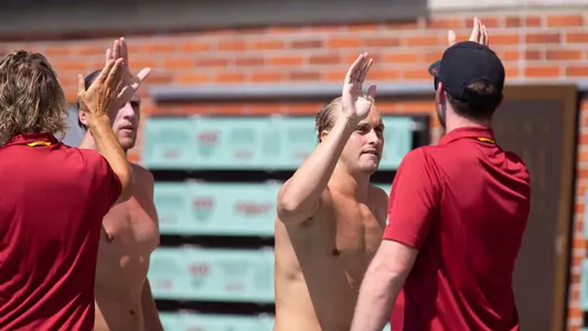 Zach D'Sa and Matt Maier high-five coaches after a USC win.