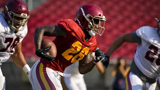 Aca'Cedric Ware runs down the field at a scrimmage at the Coliseum.