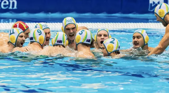 Australian water polo team cheers in the water at the 2018 FINA World Cup