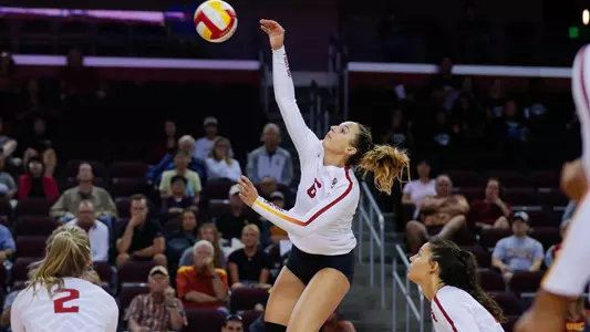 Women's volleyball opposite hitter Emily Baptista attacks the ball.