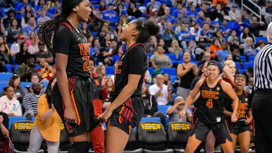 Asiah Jones and Desiree Caldwell celebrate during USC's win at UCLA