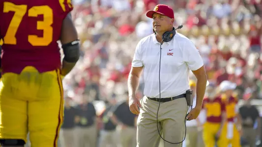 Clay Helton walks to the sideline during the UNLV game.