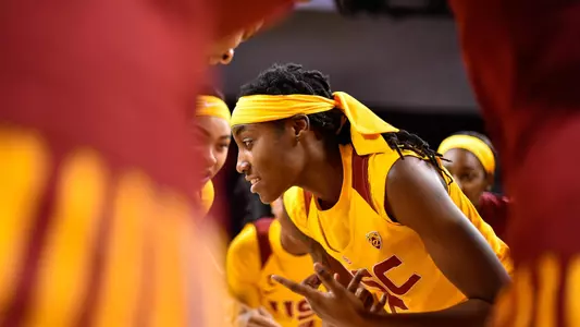 Ja’Tavia Tapley is encircled by her teammates for a pregame cheer
