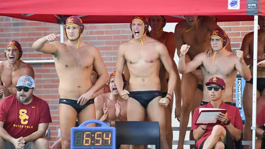 The bench cheers a goal by the Trojans vs.Long Beach State