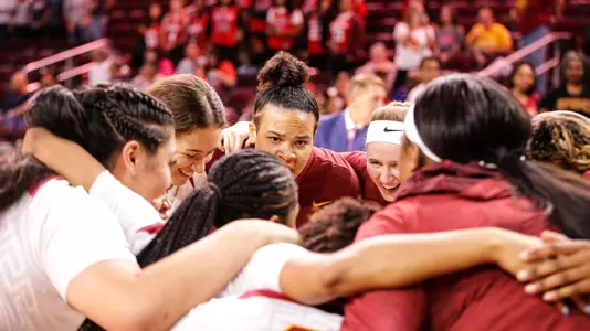 USC team huddle before win over Virginia at Galen Center