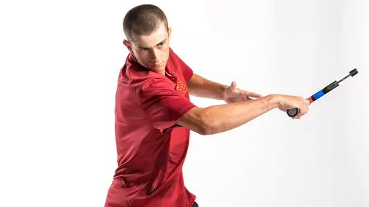 Ryder Jackson practices a forehand during a photo shoot