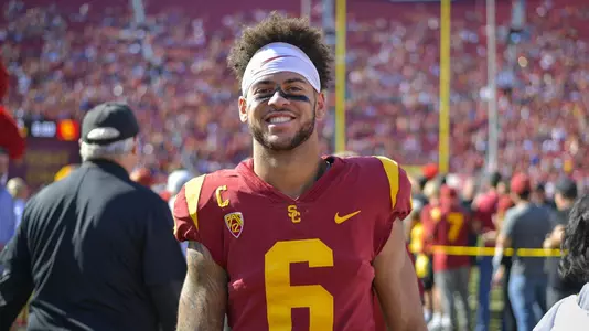 Michael Pittman Jr. smiles on the field during the Senior Day celebrations