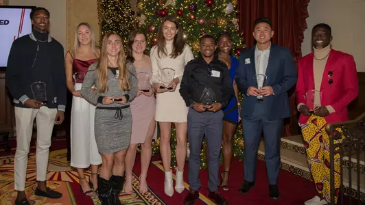 T&F Banquet Award Winners by Christmas tree