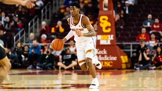 Elijah Weaver brings ball upcourt