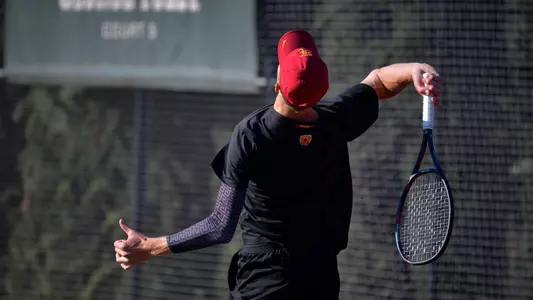 Tanner Smith serves in a match at Marks Stadium