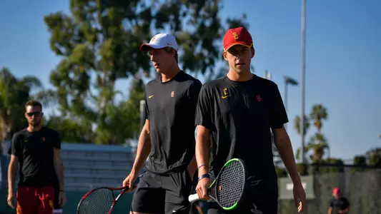 Riley Smith and Brandon Holt prepare for the next point in their doubles match